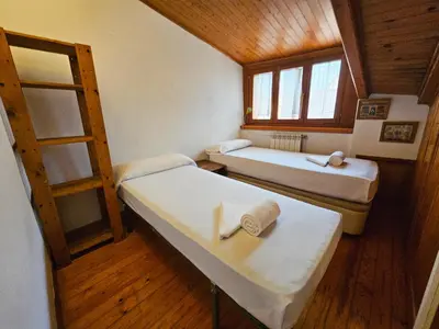 Cama o camas de una habitación en Apartamentos Jaca Ciudadela 3000