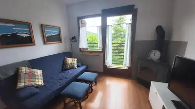 Una televisión o centro de entretenimiento en CHECK IN CASAS Pirita
