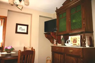 Una televisión o centro de entretenimiento en Apartamentos Casa Gallan