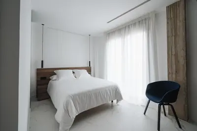 Cama o camas de una habitación en RÍOS SUITES Tudela