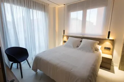 Cama o camas de una habitación en RÍOS SUITES Tudela