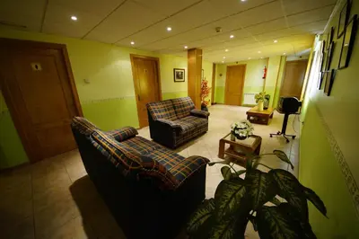 Zona de estar de Hostal Restaurante El Surtidor