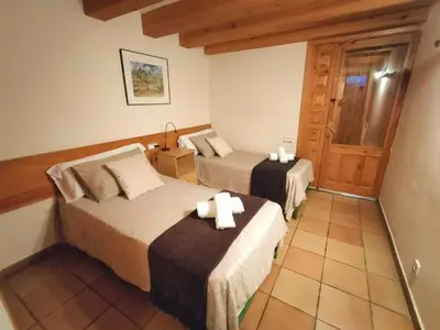 Cama o camas de una habitación en El Cajigar Ordesa Aínsa