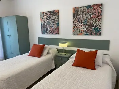 Cama o camas de una habitación en Apartamentos Alcañiz, Silvia