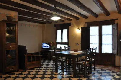 Una televisión o centro de entretenimiento en Apartamentos Turismo Rural Casa Purroy