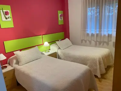 Cama o camas de una habitación en Apartamentos Alcañiz, Santa María, 3