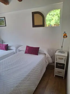 Cama o camas de una habitación en El barrio medieval de Miravet