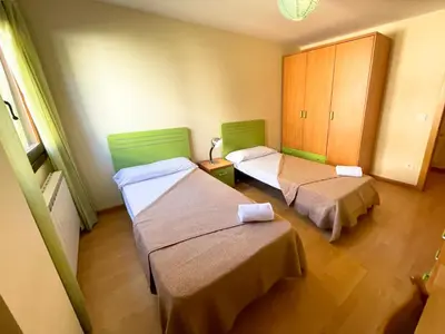 Cama o camas de una habitación en Apartamentos Villanua Collarada 3000