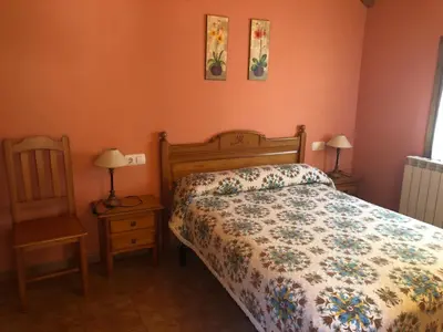 Cama o camas de una habitación en apartamentos casa botero