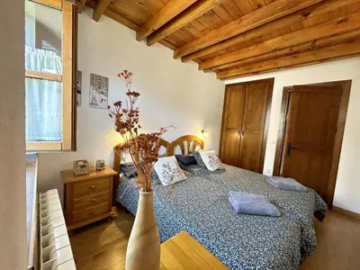 Cama o camas de una habitación en El rincón de Benás
