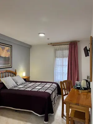 Cama o camas de una habitación en Hostal Marboré