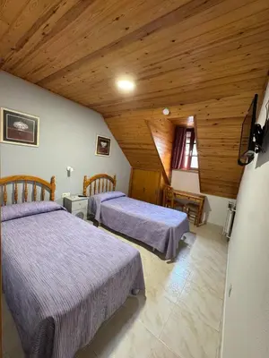 Cama o camas de una habitación en Hostal Marboré