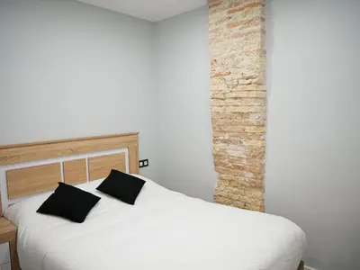 Cama o camas de una habitación en Espacioso apartamento en el centro de Pamplona