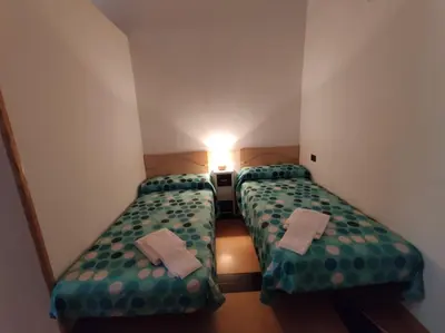 Cama o camas de una habitación en Inmocyma Soldorau-Benasque