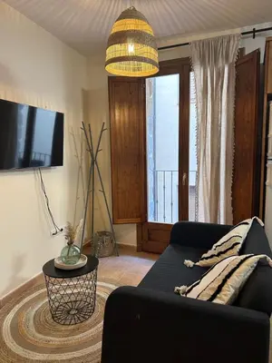 Una televisión o centro de entretenimiento en Apartamento La Fonteta