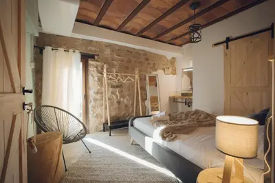 Cama o camas de una habitación en Castell de l'Aguda