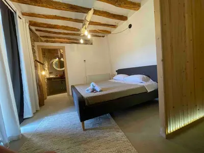 Cama o camas de una habitación en Castell de l'Aguda