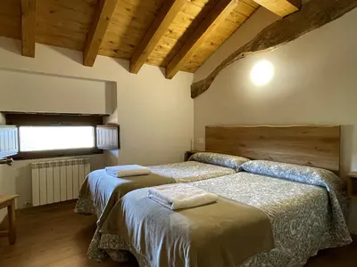 Cama o camas de una habitación en Palacio de Aralar Alta Familias
