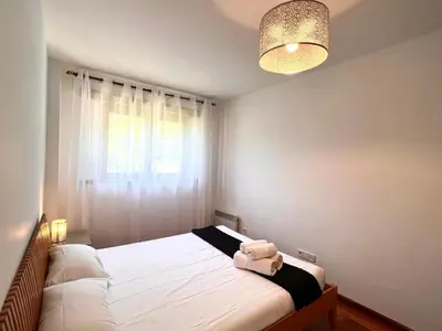 Cama o camas de una habitación en Apartament Els Raiers - L'Amfitriona