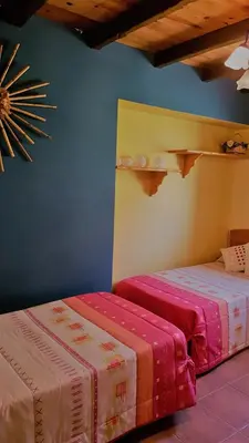 Cama o camas de una habitación en Casa Castel naturaleza y descanso