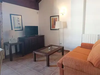 Una televisión o centro de entretenimiento en Apartamentos Jaca Badaguas 3000