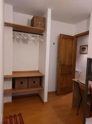 Una televisión o centro de entretenimiento en Acogedor dúplex en el Valle de Aran