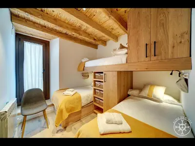 Cama o camas de una habitación en CASA CORILHA de Alma de Nieve