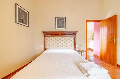 Cama o camas de una habitación en Hort de la Cinteta