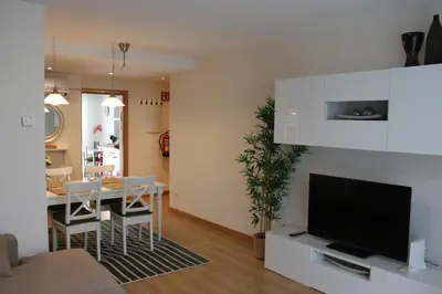 Una televisión o centro de entretenimiento en Apartamento Turístico HB