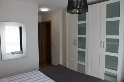 Cama o camas de una habitación en Apartamento Turístico HB