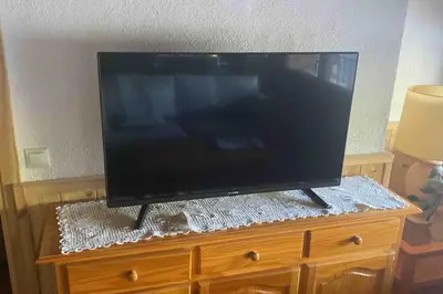 Una televisión o centro de entretenimiento en Casa Casteller