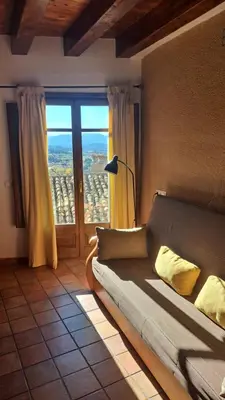 Cama o camas de una habitación en Apartamentos La Morada del Cura
