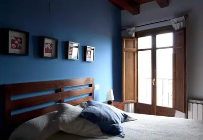 Cama o camas de una habitación en Apartamentos La Morada del Cura
