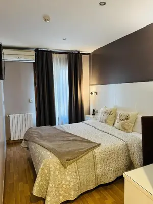 Cama o camas de una habitación en Hotel El Acebo