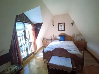 Cama o camas de una habitación en Ático en pleno pirineo