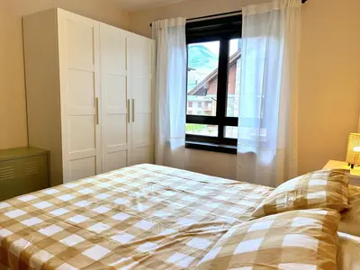 Cama o camas de una habitación en Apartament lluminós amb encant by RURAL D'ÀNEU