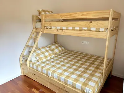 Cama o camas de una habitación en Apartament lluminós amb encant by RURAL D'ÀNEU