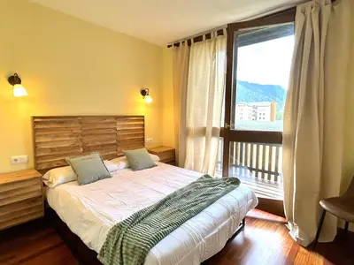 Cama o camas de una habitación en Apartament d'estil pirineic amb vistes úniques by RURAL D'ÀNEU