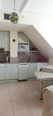 Una cocina o zona de cocina en Apartamentos Edificio Aguilas