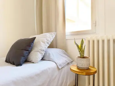 Cama o camas de una habitación en Apartamento grande en Huesca