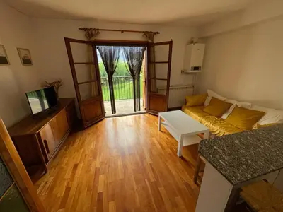 Una televisión o centro de entretenimiento en Apartamento con espectacular terraza