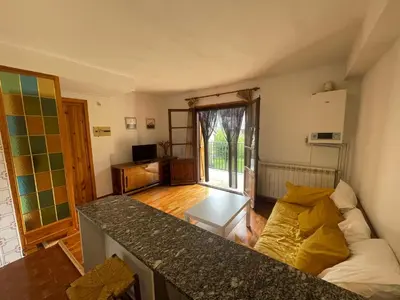 Una televisión o centro de entretenimiento en Apartamento con espectacular terraza