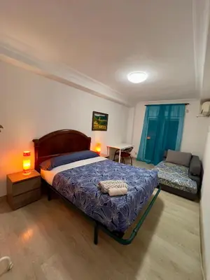 Cama o camas de una habitación en ZARAGOZA CENTRAL APARTMENT