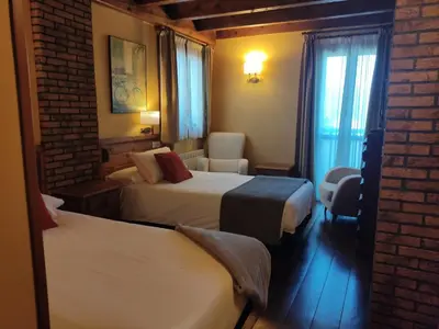 Cama o camas de una habitación en Hotel Rural Irati selva de Irati