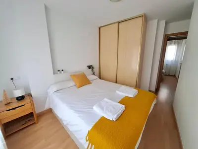 Cama o camas de una habitación en Los Pinos, acogedor apartamento con garaje - Arafita Apartamentos