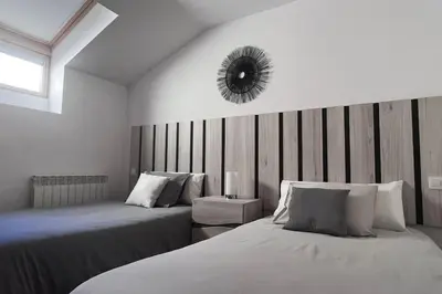 Cama o camas de una habitación en Ático con terrazas, garaje y ascensor en el casco antiguo