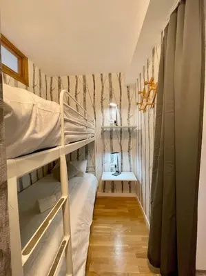 Cama o camas de una habitación en Acogedor Apartamento de 2 dormitorios con plaza de garaje