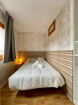Cama o camas de una habitación en Acogedor Apartamento de 2 dormitorios con plaza de garaje