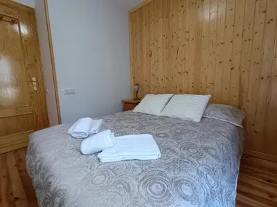 Cama o camas de una habitación en Inmocyma El Rinconcito de Benasque
