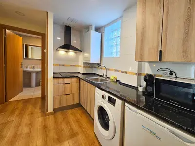 Una cocina o zona de cocina en Apartamentos Escarrilla Suites 3000